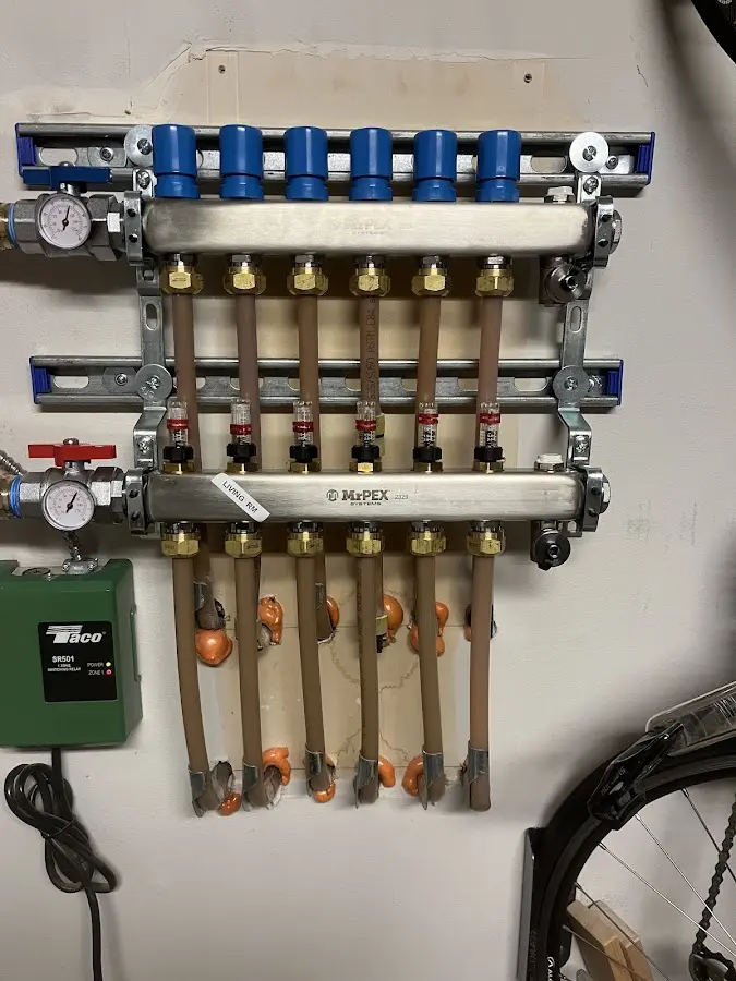 Plumber performing Water Heater Repair at a residential property in Ewing